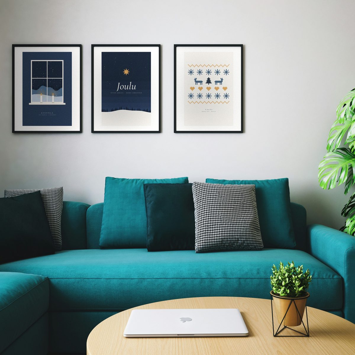 Set of three Christmas prints hanging above a sofa